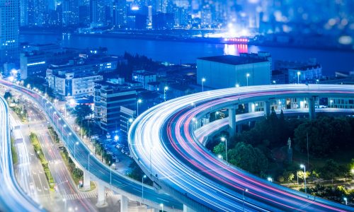 Busy highway traffic light trails at night in city of China.